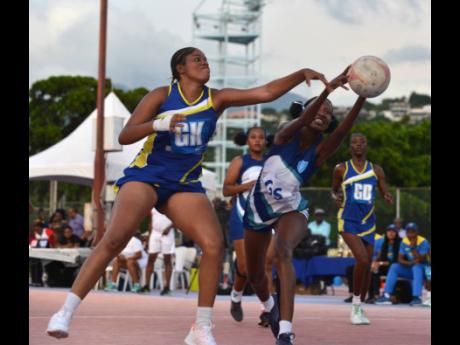 Gaynstead High’s senior goalkeeper Crystal Nicholson (left) loses the ball to St Catherine High’s goal shooter Kellian Hunter during the ISSA urban-rural schoolgirls’ netball finals at the Leila  Robinson Courts  yesterday. St Catherine won 42-29.