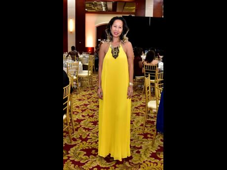 Serena Lue Whittingham, relationship manager, National Commercial Bank, stands out in yellow.