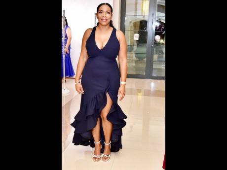 Cheryl Grierson-Bird, branch manager, CIBC First Caribbean Bank, Montego Bay, turns heads in this figure-flattering dress.