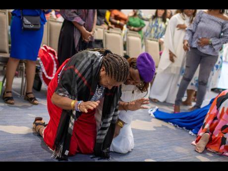 Attendees at the Repositioned International Women’s Conference lay their souls bare before the Lord, for transformation.