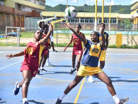 
Holmwood Technical High School’s Brianna Allen (left) tackles May Day’s Shanique Ellis during a rural ISSA Schoolgirl Netball second-round game at the G.C. Foster College, Wynter Pen Road, Spanish Town on November 27.