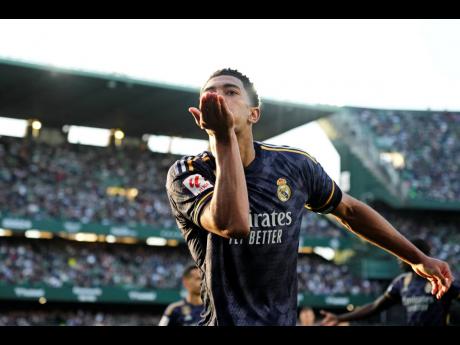 
Real Madrid’s Jude Bellingham blows a kiss to fans in celebration after scoring the opening goal during a Spanish La Liga football match against Betis at the Benito Villamarin stadium in Seville, Spain, yesterday.