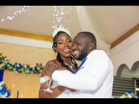 The newly-weds bask in nuptial bliss during the reception held at Skervin’s Place in Prospect, St Thomas.