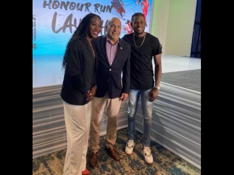 2024 Sagicor Sigma Run patrons, World Championships 400m hurdles bronze medallist Rochelle Clayton (left) and Reggae Boyz captain Andre Blake (right) with Christopher Zacca, president and CEO of Sagicor Group, at the launch of next year’s run at The Jama