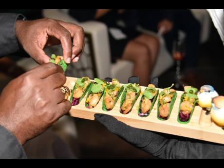 These mini Shrimp Tacos with Chipotle Mousse and Cilantro Caviar were flying off the platter. 