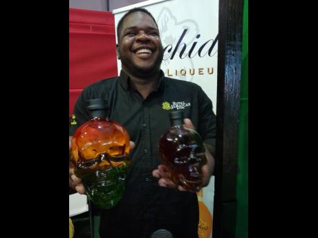 Production Supervisor Fredrick Williams is ecstatic as he displays two of Royal Jamaican’s rums at Jamaica EXPO 2023, but, in the brewery, it is serious business.