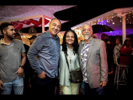From left: Minister of Health and Wellness Christopher Tufton shares the spotlight with gospel singer Carlene Davis and her husband, producer and singer Tommy Cowan.