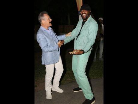 Tony Rebel (right) and Olivier Guyonvarch, the ambassador of France in Jamaica share a light moment at the launch.