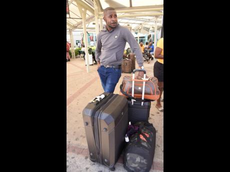 Christmas in Jamaica is different, says Dwight Smith, as he landed in Kingston on Tuesday.