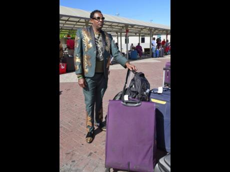 A dapperly dressed Hopeton Nelson was anxious to see family and friends in St Thomas on Tuesday after arriving at the Norman Manley international Airport in Kingston.