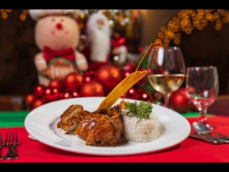 Rum-spice holiday roasted turkey served with coconut rice and sautéed vegetables.