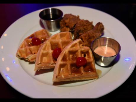 The fried chicken, served with a signature spicy sauce, is accompanied by ‘melt-in-your-mouth’ waffles and maple syrup on the side.