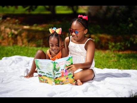 Barnaby-Cuff’s daughters, Bella-Renée (left) and Bree’Ah-Marie, are very excited to be featured as the main characters in the children’s book.