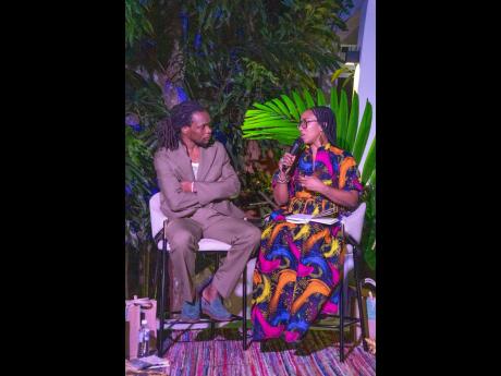Isis-Semaj Hall (right), lecturer in the Department of Literatures in English at The University of the West Indies, in conversation with Ishion Hutchinson at his book launch in upper St Andrew.