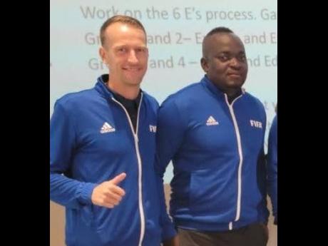 Jermaine Thomas (right) with Eric Rademakers at a recent FIFA-Concacaf coach educators’ course in Jamaica.