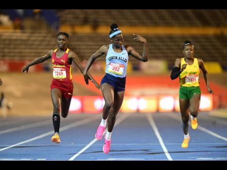 Edwin Allen High School’s Theianna-Lee Terrelonge (centre) wins the girls’ Class 3 100 metres at the ISSA/GraceKennedy Boys and Girls’ Athletics Championships at the National Stadium in St Andrew, Jamaica, on March 29, 2023.