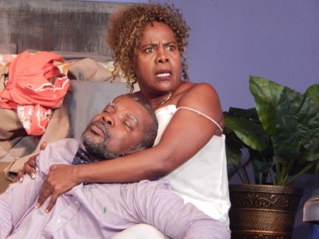 While her lover, Elton (Dennis Titus), lies unconscious in her arms, Millicent (Deon Silvera) continues to quarrel with him. This scene is from Basil Dawkins’ latest play, ‘Once Upon a Watch Night’.