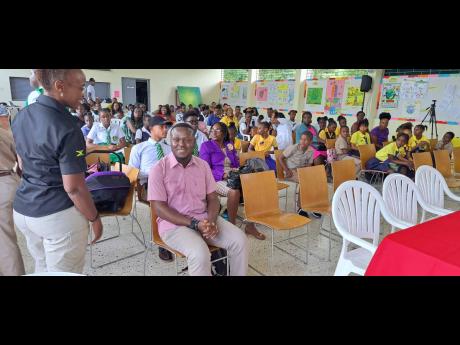 
Odane Brooks, CARICOM youth ambassador, (seated) speaks with Glenda Green, country head of Peace Corps Jamaica (PCJ) at Highgate Youth Climate Change Expo & Fair organised by the PCJ.
Odane Brooks, CARICOM youth ambassador, (seated) speaks with Glenda Gre