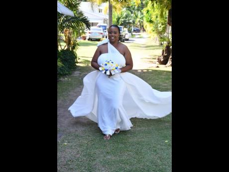 This exquisite curve-hugging mermaid gown, worn by Chantal Cogle-Bell from Unions Bridal Boutique, features a one-shoulder overlay and detachable train. 