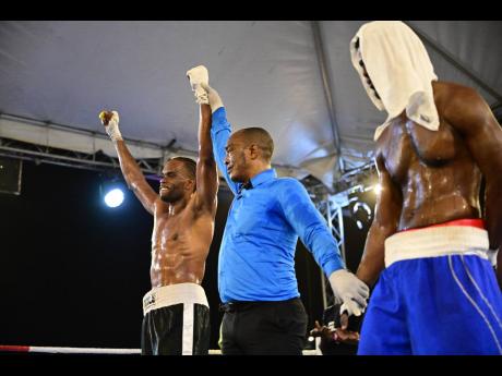 Jermaine ‘Breezy’ Richards (left) of I Fights Promotion celebrates victory over Stephen Kirnon of Bronx Boxing Gym in a heavy weight bout at Wray and Nephew Fight Nights held at Cling Cling Oval in St Andrew, Jamaica on Saturday, July 1.