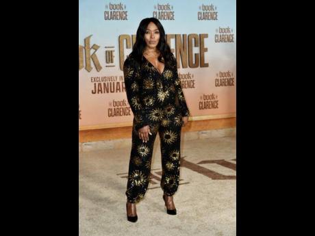 Angela Bassett rocked a black and gold jumpsuit by Farm Rio.