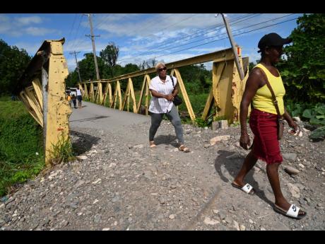 Residents of Spring Village using the bridge which has been closed to the public for over a year. 