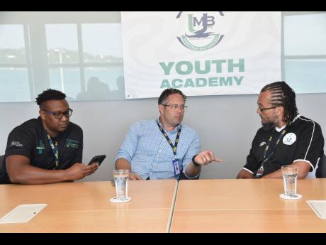 From left: Dr Germaine Spencer, president of Montego Bay United Football Club, Yoni Epstein, Montego Bay United Football United F.C chairman, and Sulaiman Nunes, head coach of Montego Bay United F.C Youth Academy in conversation during a press conference a