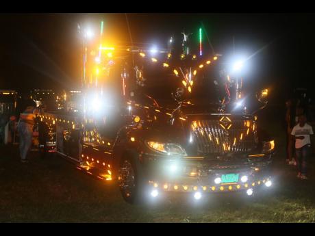 The lights on the trucks were a perfect backdrop for truck enthusiasts at the Munk Garage Truck Show and New Year’s Eve Party at the Woodleigh Sports Complex in May Pen, Clarendon.