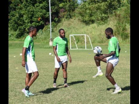 From left: Courtney Allen, Jourdaine  Fletcher and Darnell Hospedales, three of the seven new Montego Bay United  players, at a training session at Wespow Park in Montego Bay yesterday.