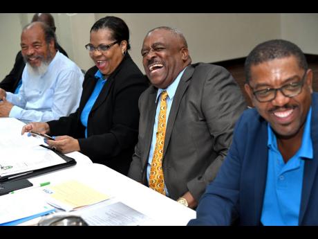 Raymond Anderson (second right), vice-president of the Jamaica Football Federation (JFF), sits next to Pat Garel (third right), along with Dave Cameron and Carvel Stewart (left) during a press conference about the JFF’s election misconduct at the Liguane