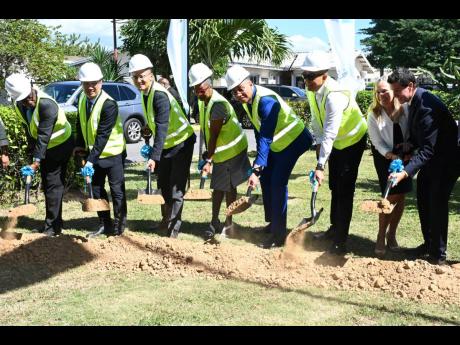 From left: Breaking ground are Abdon Campbell, parish manager; Gang Li, project manager of Jiangsu Zhenhai Construction Limited; Biao Ding, manager of Jiangsu Zhenhai Construction Limited; Jacqueline Ellis, CEO of Spanish Town Hospital; Prime Minister Andr