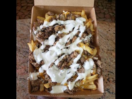 It doesn’t get any tastier than this jerk chicken loaded fries.
