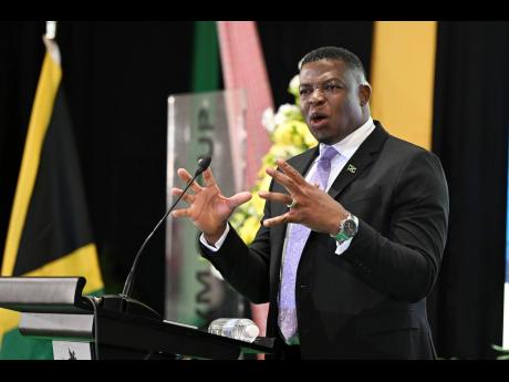 Reverend Omar Morrison, of First Missionary Church, delivering the main address at the 44th staging of the National Leadership Prayer Breakfast at The Jamaica Pegasus hotel yesterday.