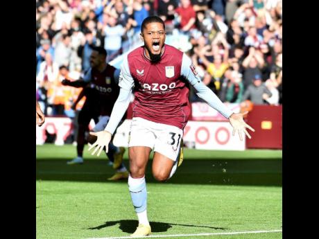 Aston Villa’s Leon Bailey celebrates after scoring the opening goal during the English Premier League match between Aston Villa and Brentford at Villa Park in Birmingham, England, Sunday, October 23, 2022. 