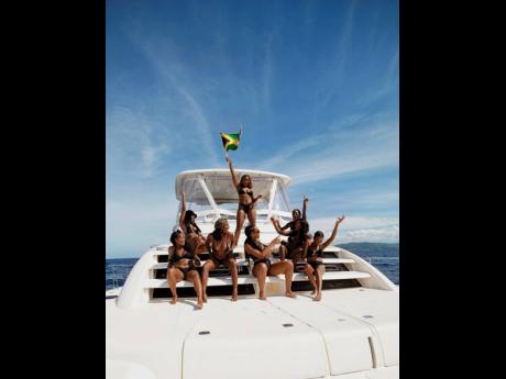 Adams and her girls bask in the island sun, making waves as Jamaican hotties on a yacht.