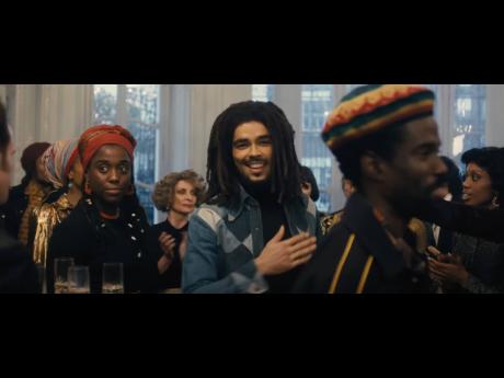 From left: Lashana Lynch as Rita Marley; Kingsley Ben-Adir as Bob Marley; and Hector Lewis as Carlton ‘Carly’ Barrett, in a scene from ‘Bob Marley: One Love’ which opens in theatres February 14.