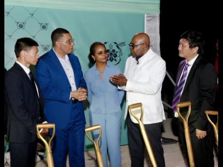 Prime Minister Andrew Holness (second left) is in a conversation with Yangsen Li (left), chief executive officer (CEO), LCH Developments; Marlene Malahoo Forte, minister of legal and constitutional affairs; Edmund Bartlett, minister of tourism; and Ziping 