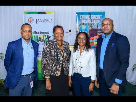 President of the Jamaica Promotions Corporation (JAMPRO), Shullette Cox (second right), shares a photo opportunity with (from left) Interim Vice President, Export Division, JAMPRO, Shane Angus; Manager, Exporter Facilitation, JAMPRO, Delaine Morgan; and Ma