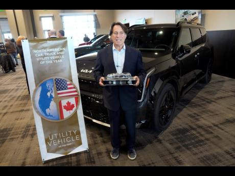 
Steven Center, chief operating officer and executive vice-president, Kia America stands with the Kia EV9 after winning the 2024 North American Utility Vehicle of the Year.