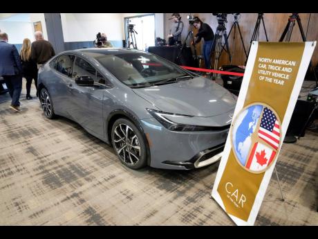 A Toyota Prius is displayed after winning the 2024 North American Car of the Year award.