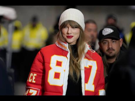 
Taylor Swift wears a Kansas City Chiefs tight end Travis Kelce jacket as she arrives before an NFL wild-card playoff football game between the Chiefs and the Miami Dolphins on Saturday, January 13, 2024, in Kansas City, Missouri.