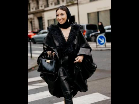 Jeannie Mai hits the mark in Stephane Rolland and a black Brandon Blackwood Jasmine bag for Paris Couture Week. 
