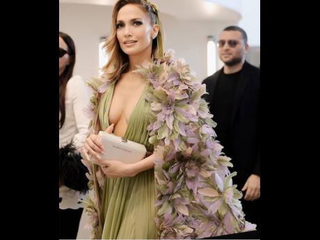 Jennifer Lopez in the 1-1 satin Brandon Blackwood Kendrick clutch for Elie Saab’s Paris Couture Week show.