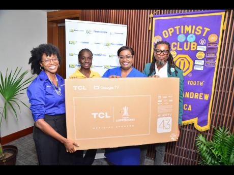 NCB Foundation Director Kenia Mattis (left) presents a 40” Smart TV to St Simon Basic School principal Audrey Forrester Saddler (second right). As part of the Grant A Wish 2023 campaign, the Optimist Club wrote to NCB Foundation seeking assistance for th