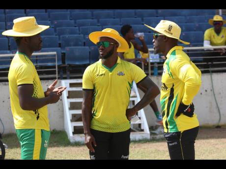 Jamaica Scorpions players (from left)  Chadwick Walton, Jermaine Blackwood and Derval Green chat following a practice session at Sabina Park on Thursday.

 