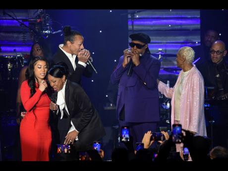 Keyshia Cole, from left, Gladys Knight, Frederic Yonnet, Stevie Wonder, and Dionne Warwick appear during the Pre-Grammy Gala on February 3, , at the Beverly Hilton Hotel in Beverly Hills, California. 
