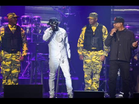 
Flavor Flav, left, and Chuck D and of Public Enemy perform during the Pre-Grammy Gala on Saturday.