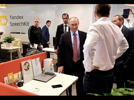 File photo shows Russian President Vladimir Putin (centre) on a visit to Russia’s largest Internet search engine Yandex headquarters in Moscow, Russia, on September 21, 2017. The Dutch parent of pioneering Russian tech company Yandex is selling its opera