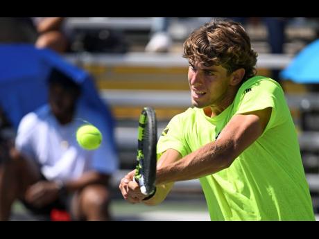 Jamaica’s Blaise Bicknell plays a backhand during his opening-day Davis Cup singles victory over Kaipo Marshall at the Eric Bell Centre on Saturday.