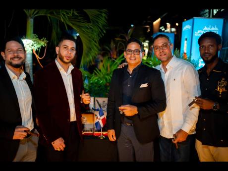Posing for the camera are (from left) Jancer Fermín, head of cultural affairs and special projects, Embassy of the Dominican Republic in Jamaica; Jenfry Rodríguez, president of J Rod Cigars; Miguel Balaguer, head of political affairs, Embassy of the Domi
